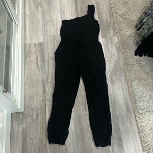 Black cotton one shoulder jumpsuit with tie waist and pockets